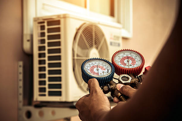 Professional Heat Pump Repair technician working in Wheeler, IN